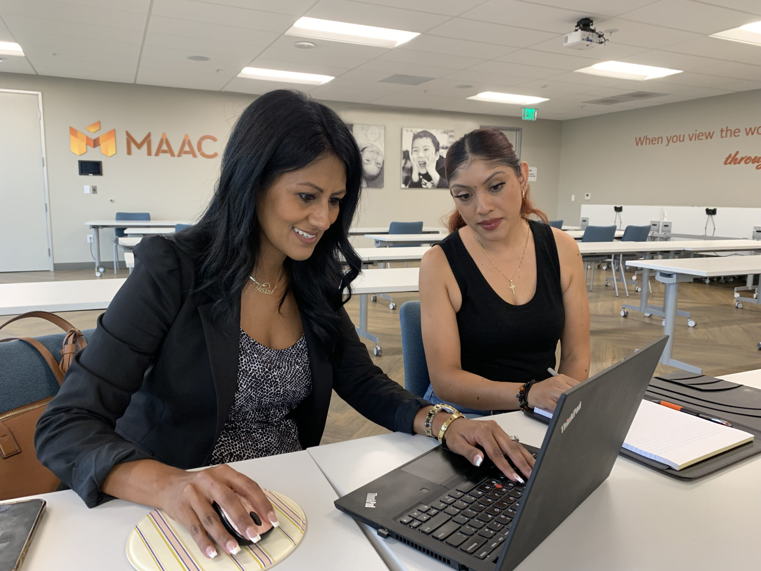 Women at MAAC sitting at laptop