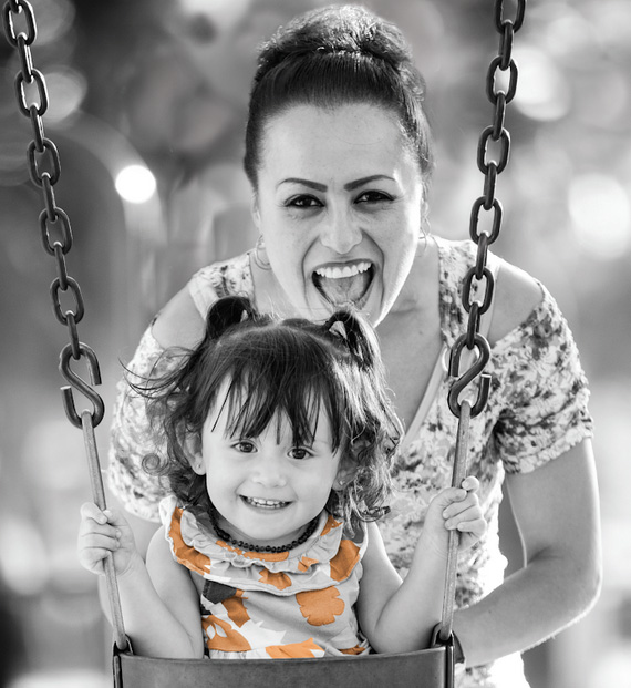 women and child on swing